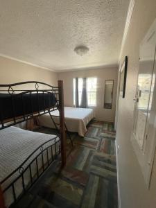 a room with two bunk beds and a hallway at Admiral's Cove Resort in Lemoyne