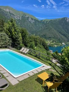 a swimming pool with a view of a mountain at Casa Europa in Ledro