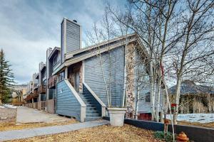 a house with stairs on the side of it at Whispering Pines in Durango Mountain Resort