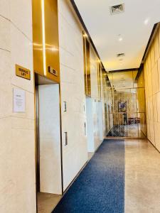 a hallway with a door in a building at Nova Spira in Noida