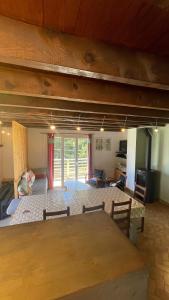 a large living room with a table and a living room at Chalet Rec Fred in Matemale +13 photos
