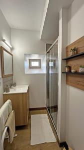 a bathroom with a shower and a sink at Chez mémé marie in Rilhac-Lastours +52 photos