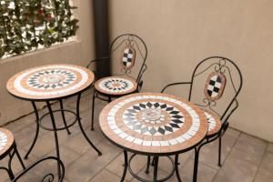 a group of tables and chairs with a christmas tree at No. 55 in Buzău