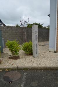a stone marker in a yard next to a fence at Treacy's Hotel & Slaney Suites Wexford in Enniscorthy