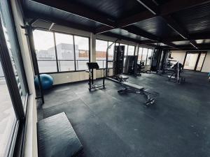 an empty gym with treadmills and machines in a building at Condo with Beach Access By MME in Tatuamunha