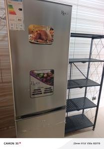 a refrigerator with a picture of a turkey on it at Baie des Anges in Lomé
