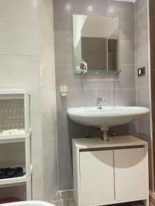 a bathroom with a sink and a mirror at Casa vacanze Da Fra in Cariati