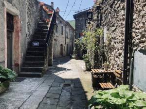 an alley with stairs and benches in an old building at Loft nel borgo di Tavernelle in Tavernelle