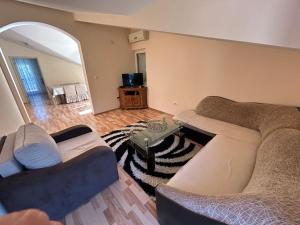 a living room with a couch and a table at Apartman Savo in Kotor