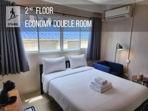 a bedroom with a bed and a room with a window at Lo-Ha Guest house, Contactless Check-in in Bangkok