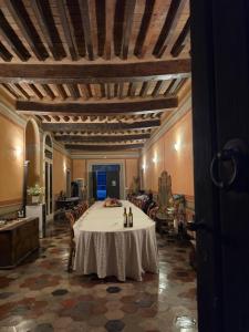 a large room with a table and chairs in it at Podere Pradarolo in Varano deʼ Melegari