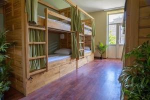 a room with two bunk beds in a house at Sahil Bay Hostel in Baku