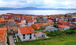 an aerial view of a town next to the water at Albergue de Sonia in Finisterre