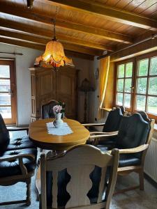 a dining room with a table and chairs at Meisehof in Buchholz Aller +16 photos
