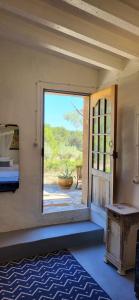 a room with a door open to a patio at Mas de Mingall in Les tres Cales +38 photos