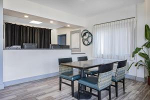 a dining room with a table and chairs at Days Inn by Wyndham Waynesville NC in Waynesville