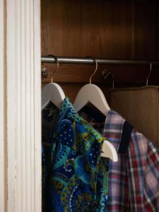 a couple of shirts are hanging on a rack at Die Gute Stube in Dobritz