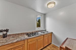a kitchen with a sink and a window at Econo Lodge Inn & Suites Heavenly Village Area in South Lake Tahoe +78 photos
