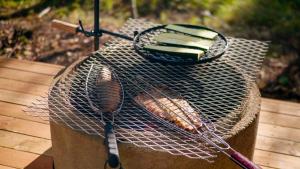 a bird cage with two rackets on top of it at Aurakoski 1 in Ranua