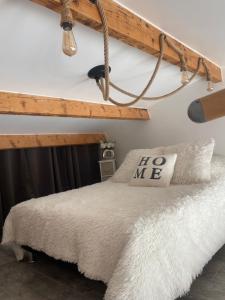 a bedroom with a bed and a wooden shelf at Duplex sur Marinas Cap d'Agde in Cap d'Agde