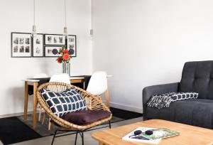 a living room with a couch and a table at Cannes - Modern balcony flat perfect location in Cannes