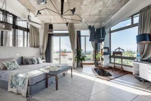 a bedroom with a bed and large windows at Villa Mauritius - Designer Private Studios in Pointe aux Sable +61 photos