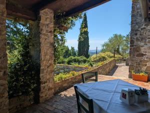 a table with a blue table cloth on a patio at Hotel Conti Formentini in San Floriano del Cóllio