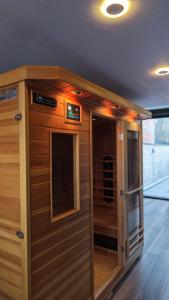 a wooden cabin with a door in a room at Belgrade River House in Belgrade