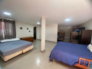 a bedroom with two beds at Sítio em Guarapari in Guarapari