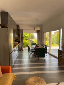 a kitchen and dining room with a table and chairs at Villa Elpiniki in Ixia