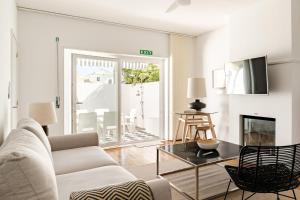 a living room with a couch and a table at 30m to Beach - Mindelo Ocean House in Mindelo