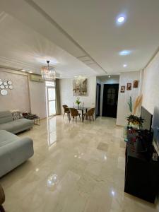 a living room with a couch and a table at Appartement de lux in Casablanca