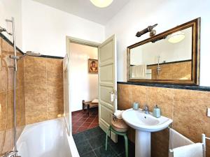 a bathroom with a sink and a shower and a toilet at Villa Carla - vicino alla Riviera del Conero e ai Colli dell' Infinito in Ancona +41 photos