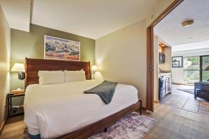 a bedroom with a large bed and a bathroom at Beaver Run Resort 4228 - Dog Friendly in Breckenridge