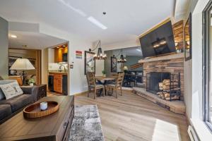 a living room with a couch and a fireplace at Beaver Run Resort 4228 - Dog Friendly in Breckenridge