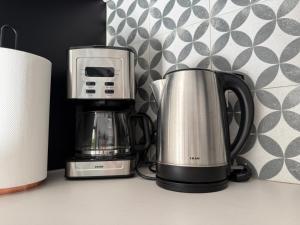 a coffee maker and a toaster on a counter at Kalithea Palekastro in Palekastron