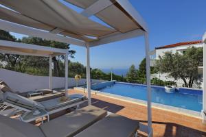 a view of a swimming pool from a villa at Pelagos in Stafylos
