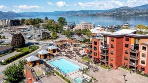 an aerial view of a city with a pool at Luxury Playa Del Sol Condo 435 w Pool, Hot Tub & Beach Nearby in Kelowna