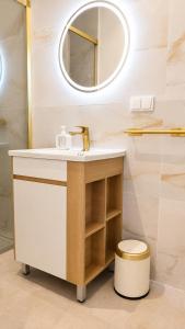 a bathroom with a sink and a mirror at Social Lodge Happiness Studios in Funchal +62 photos