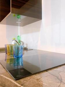 a counter top with a glass bowl and a sink at Toyo Yoyoginumi in Tokyo +77 photos