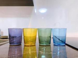 three different colored glasses sitting on a table at Toyo Yoyoginumi in Tokyo