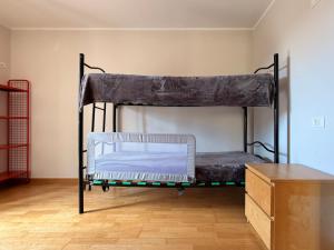 a bunk bed in the corner of a room at Pieve Antica in Piazza
