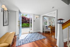 a living room with a door leading to a yard at Sand Simeon - Relax, Unwind, Repeat in Chatham