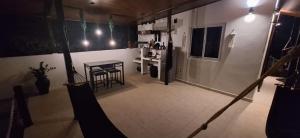 an overhead view of a kitchen with a table and a refrigerator at Stone Hill farm & cabins in Penonomé +28 photos