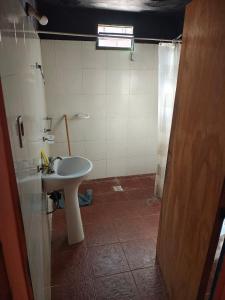 a bathroom with a sink and a shower at Virgen del valle in Fiambalá