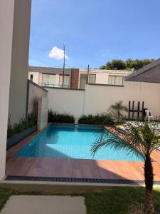 a swimming pool in the backyard of a house at Monoambiente Amplio in Tarija