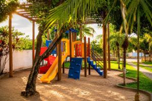 a playground with a slide in a park at Pousada Voo das Garças in Bonito