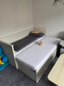 a bunk bed with a dog sitting on top of it at Ferienwohnung im Grünen in Gößweinstein