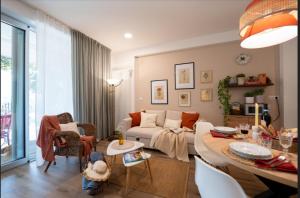 a living room with a couch and a table at RossoMattone CountryHouse in Sulmona