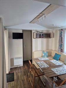 a living room with a table and a couch at ZEN cocoon in Ivry-la-Bataille